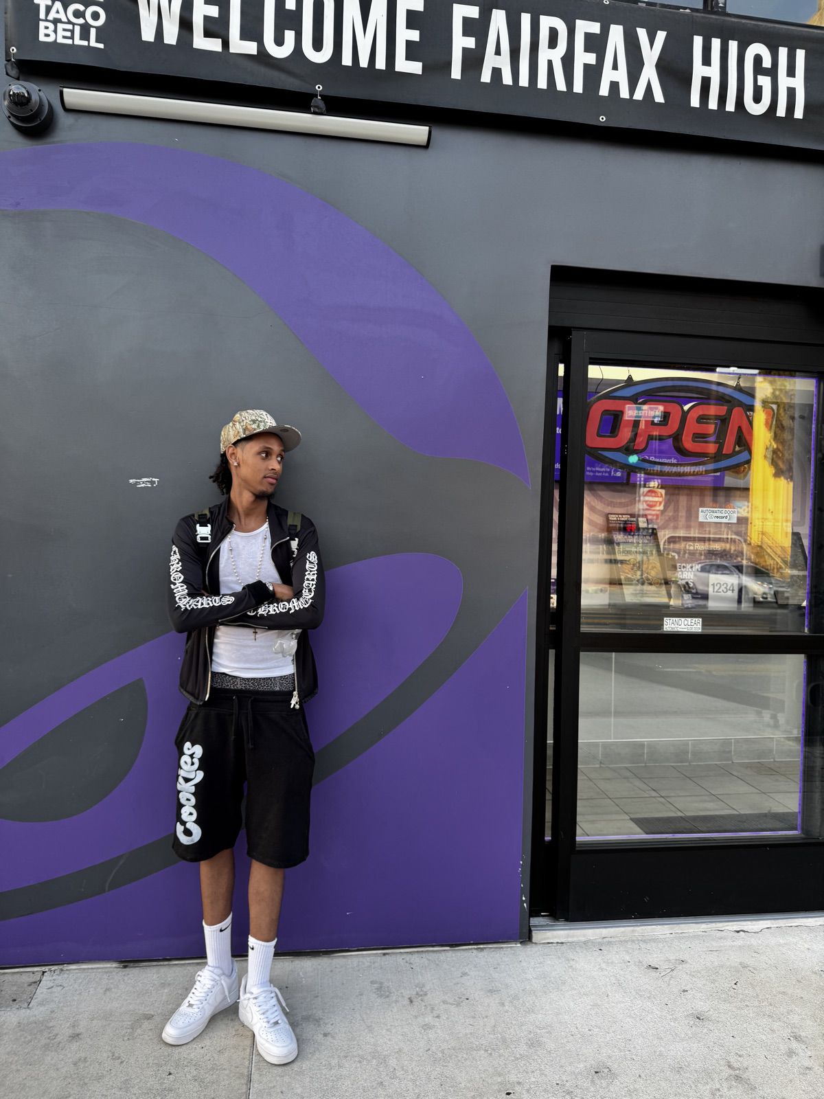 Dash in Los Angeles in front of a purple wall