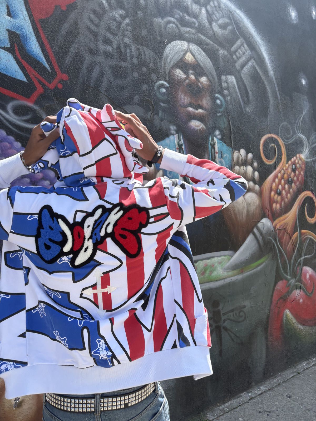 Jacket in front of a mural